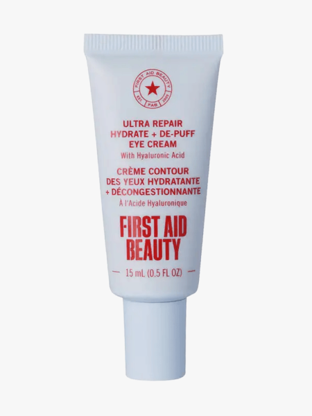 First Aid Beauty Ultra Repair Eye Cream in branded tube component on a light gray background