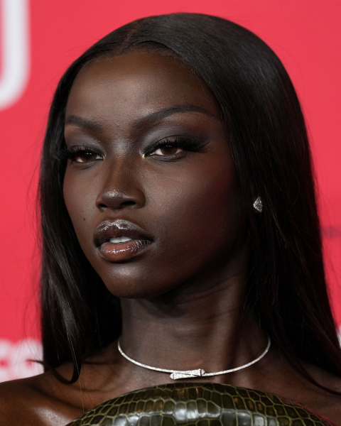 Closeup of Anok Yai with Shellac gloss makeup.
